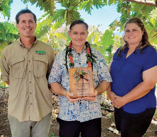 The Westin Maui Resort & Spa Chief Engineer Duane Sparkman (center) is presented the 2021 Malama i ka Aina Award from Maui Invasive Species Committee Manager Adam Radford (left) and Maui Association of Landscape Professionals President Allison Wright.